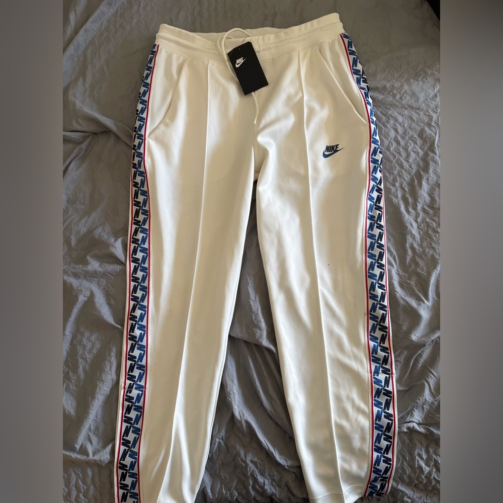 Nike Men's White Joggers with Blue Accents